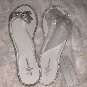 Size10(runs small)white & silver jelly sandals